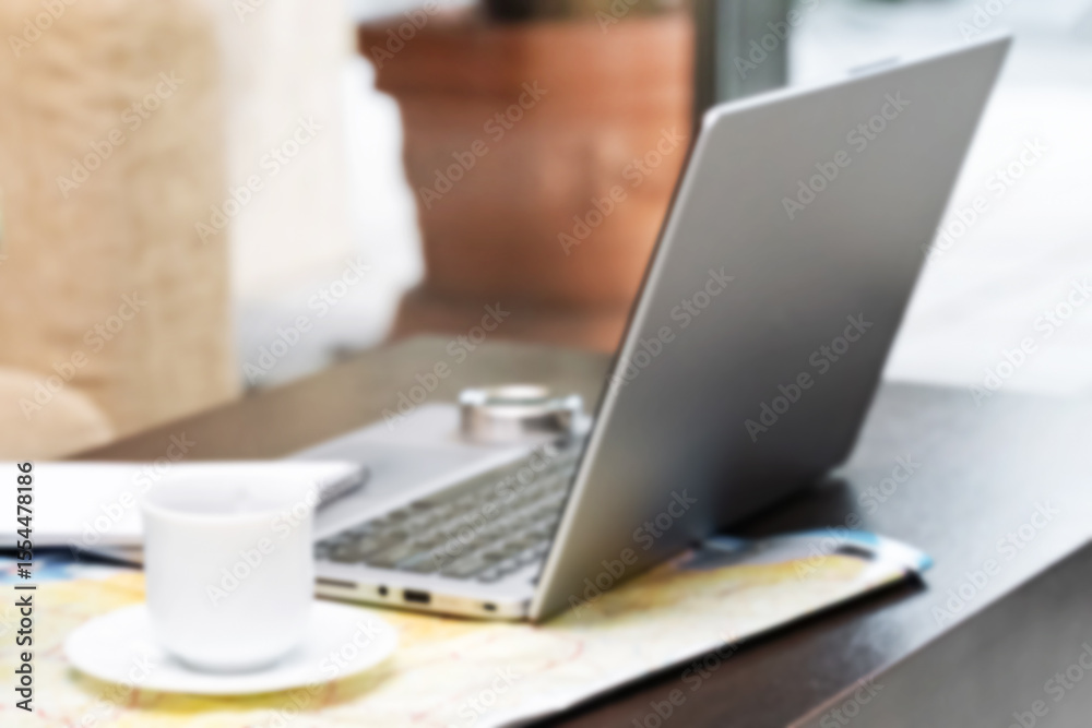Fototapeta premium Freelancer working on education project using laptop in cozy online geography workspace. Blurred focus