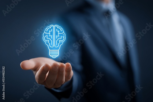 Vibrant photo of businessman's hand holding a glowing light bulb with a brain icon, representing the concept of innovation and creative thinking, with a blue color theme.