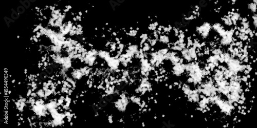 Snowflakes on dark background. white icy snowflakes isolated on black background, natural background. white crystalline powder on a black background. sugar dust. texture, pattern and clipping.