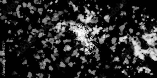 Snowflakes on dark background. white icy snowflakes isolated on black background, natural background. white crystalline powder on a black background. sugar dust. texture, pattern and clipping.