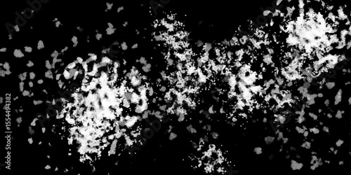 Snowflakes on dark background. white icy snowflakes isolated on black background, natural background. white crystalline powder on a black background. sugar dust. texture, pattern and clipping.