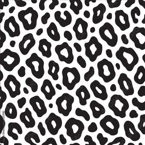 Leopard print pattern with bold black spots white background, creating stylish and modern look