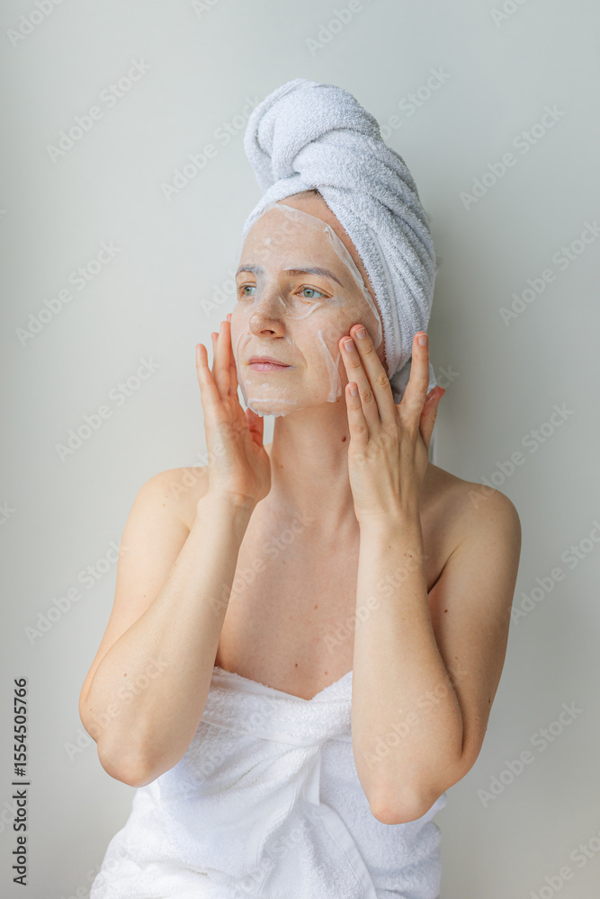 custom made wallpaper toronto digitalYoung woman relaxing at home with a hydrating facial sheet mask.  kincare routine, beauty treatment, and wellness lifestyle concept.