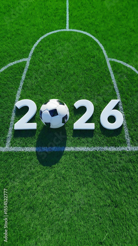 Soccer ball on green field with 2026