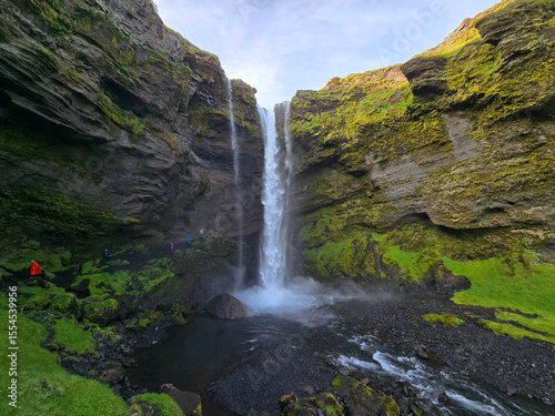 Discover the breathtaking Kvernufoss waterfall in Icelands lush landscape