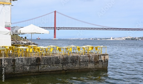 Chairs and tables on the Tagus River in Lisbon, Portugal