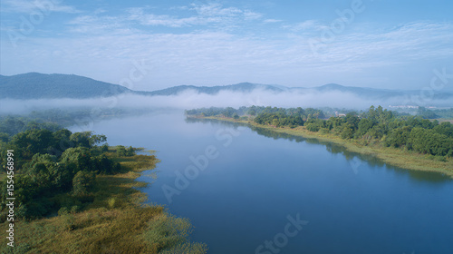 Discover the Breathtaking Harmony of Nature: A Serene River Amongst Mountains and Mist, Perfect for Meditation and Exploration in the Great Outdoors