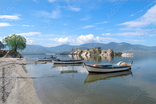 Fototapeta Naklejka Na Ścianę i Meble -  Kapıkırı, Muğla, Turkey; Herakleia Ancient City or Latmos Herakleia in Lake Bafa is one of the urban settlements of the Ancient Ionian region. Fishing boats in Lake Bafa.
