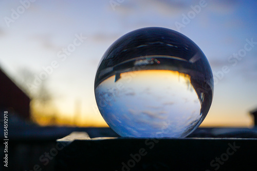 Close up of a crystal ball against sky