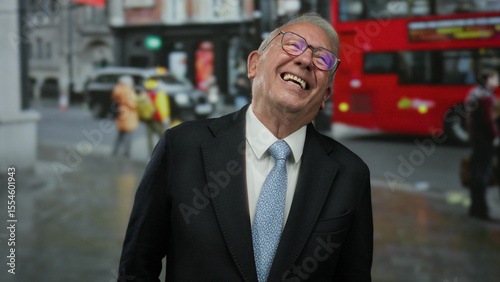 Canvas Print Senior man smiling in suit on a busy london street with iconic red double-decker buses showcasing his cheerful expression amidst the urban landscape