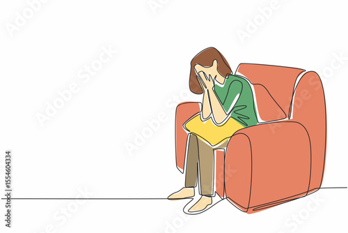 Continuous one line drawing woman sitting on a single sofa covering face with both palms. Receiving bad treatment. Stress. National Anxiety Screening Day. Single line draw design vector illustration
