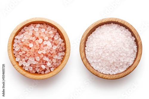 Assorted natural sea salts in wooden bowls for culinary and spa use