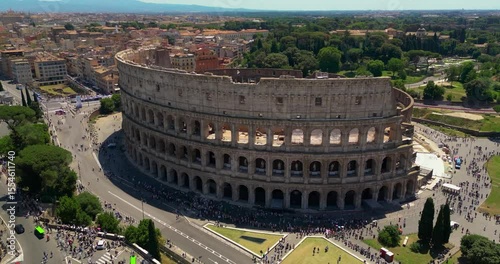 4K Aerial Footage of the Colosseum in Rome During the Day with Clear Views of Ancient Architecture and Historic City Surroundings