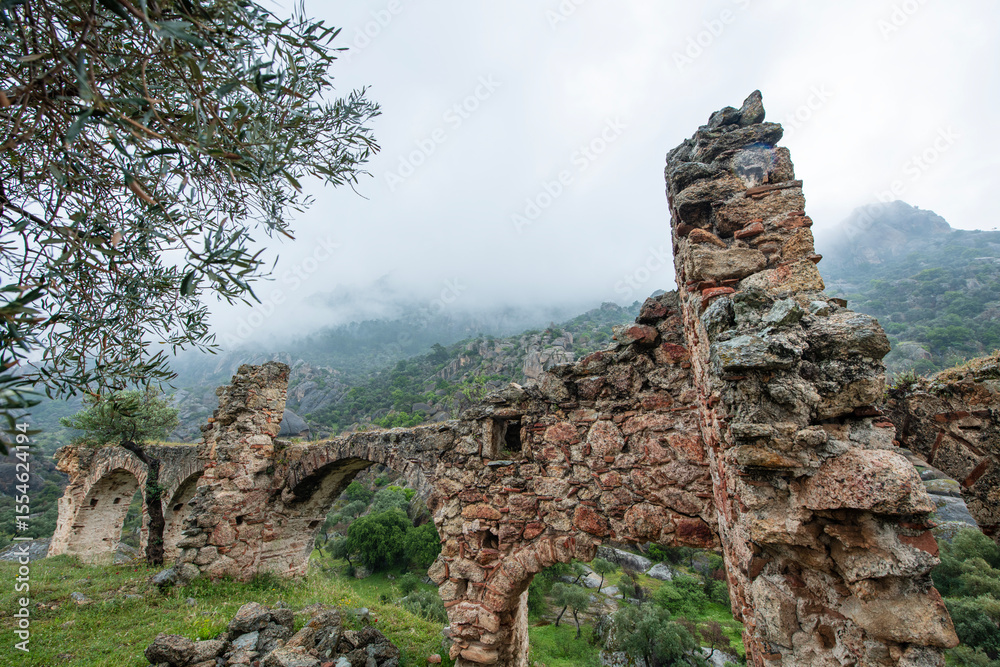 Fototapeta premium Historical places on the magnificent Latmos trekking route. Latmos Carian road, Yediler Monastery and Castle. Historical ruins on the Latmos Carian road.Muğla, Turkey. 
