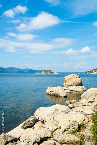 Fototapeta Naklejka Na Ścianę i Meble -  Spectacular Bafa Lake view in sunny and cloudy weather. Reflections in Bafa Lake. View of Bafa Lake Nature Park in Türkiye.