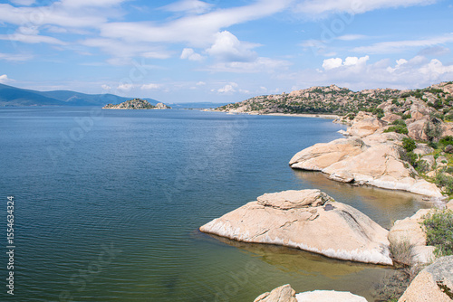 Fototapeta Naklejka Na Ścianę i Meble -  Spectacular Bafa Lake view in sunny and cloudy weather. Reflections in Bafa Lake. View of Bafa Lake Nature Park in Türkiye.