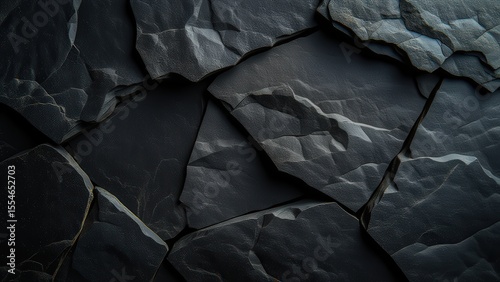 Textured Black Slate Stones with Intricate Patterns and Layers