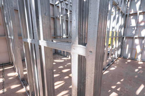 Steel frame commercial building under construction. The steel girder framework of a new building