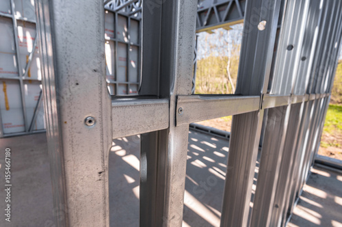 Steel frame commercial building under construction. The steel girder framework of a new building
