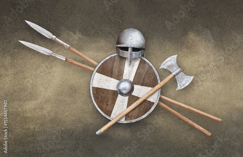 viking helmet axe shield and two spears on grunge background