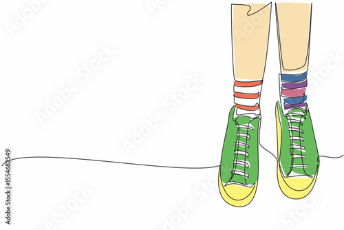 Single continuous line drawing pair of feet wearing socks with different stripes on the right and left. Everyone has the right to wear anything. Anti Bullying Day. One line design vector illustration