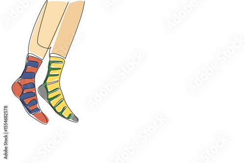 Single continuous line drawing a pair of feet wearing socks with different stripes on the right and left. Walk freely with confidence. Freedom. Anti Bullying Day. One line design vector illustration