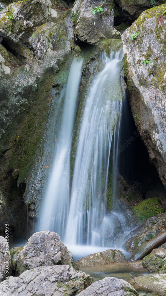 Fototapeta premium waterfall among the stones
