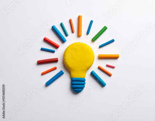 Colorful clay light bulb symbol on white backdrop. Represents innovation, creativity, and new ideas. Bright, artistic, and cheerful concept.