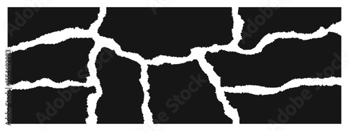 Black and white abstract design features irregular cracks, creating a striking visual effect. The textured pattern adds depth and contrast to the surface, with sharp lines and varying widths.