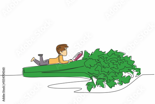 Continuous one line drawing boy reading on celery. Reading while lying on the stomach. Meaningful relaxation. Boy Reading Book at Vegetables and Fruits. Single line draw design vector illustration