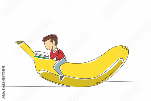 Single continuous line drawing young boy reading on banana. Learn the benefits of fruit for the body. Health conscious. Boy Reading Book at Vegetables and Fruits. One line design vector illustration