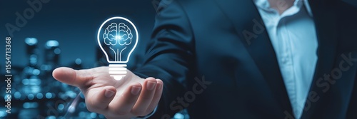 Businessman presenting glowing brain-shaped light bulb above open hand, symbolizing creative innovation, intelligence, and future technology