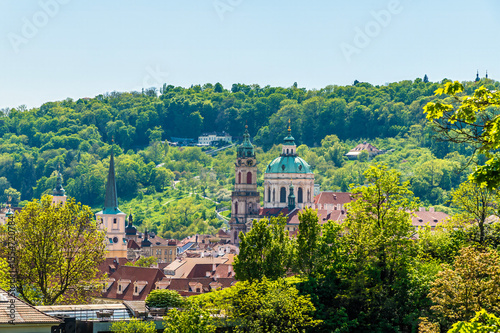 A view from the castle gardens towards buildings on the west bank of the Vltava river in Prague in springtime