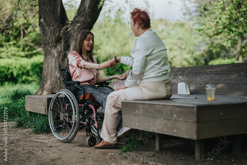 Εκτύπωση καμβά A compassionate scene featuring two women in an outdoor park