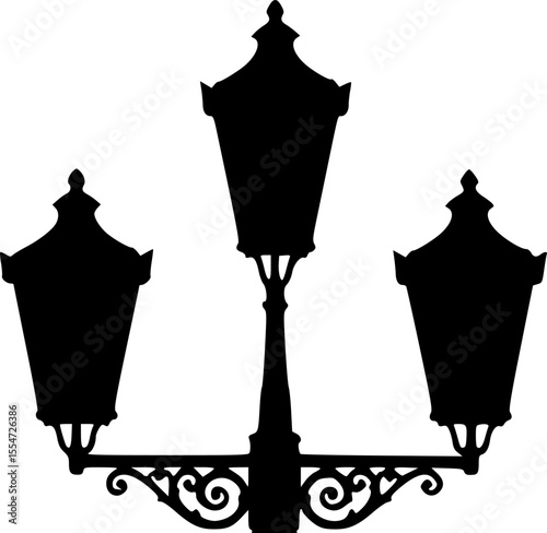 Classic Silhouette of a Vintage Street Lamp Post Illuminating the Night
