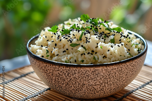 Bowl of fluffy rice topped with fresh garnish