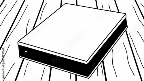 A simple illustration of a square box with a black stripe on a wooden surface with sparkles on it