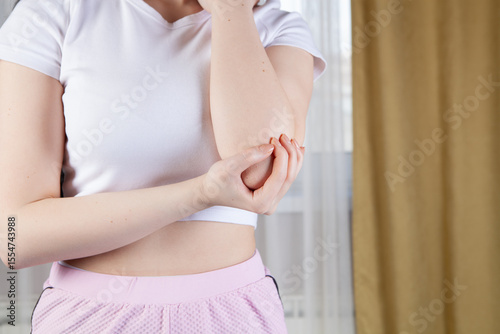 young woman doing exercise on floor in home room at morning