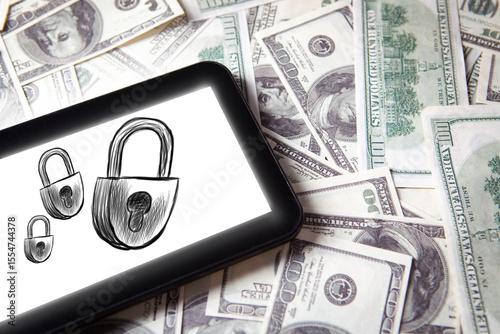 smartphone and padlock on the background of the money