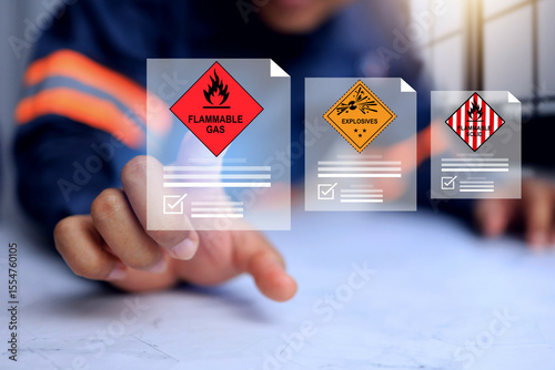 Flammable gas and hazardous substance concept with safety staff pointing on document detail for dangerous goods reports while declare category in shipping cargo and storage area