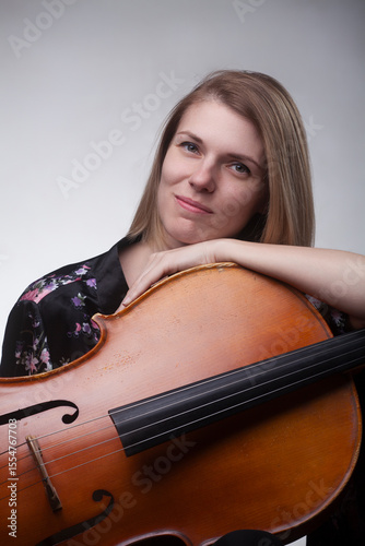 Woman leaning on cello