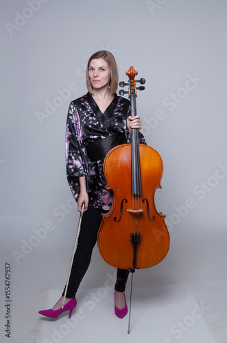 Woman with Cello, Bow, and Black Floral Robe