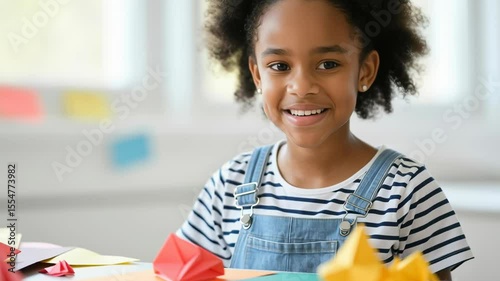 happy young girl engaging in origami craft activity, creating colorful paper shapes at home, promoting creativity and fine motor skills, joyful and focused expression