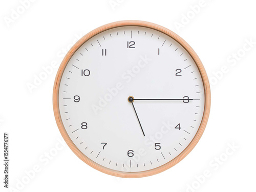 Minimal wall clock with light wood frame and white face displaying 05:15 or 17:15. Perfect for clean, modern concepts about time and scheduling.