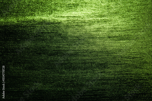 Close up of a green textured fabric with horizontal lines and subtle light variations across surface