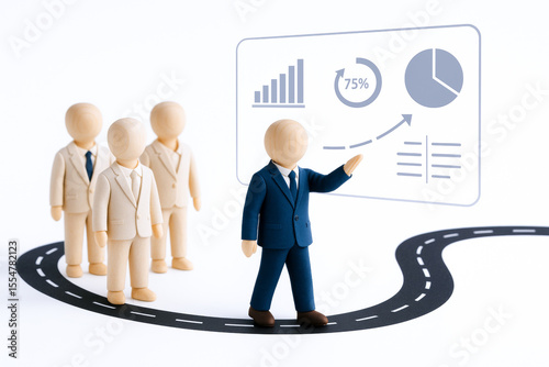 Group of wooden figurines dressed business suits are standing curved road with figure dark suit presenting data transparent screen. scene depicts agile leadership and concept of guiding teams