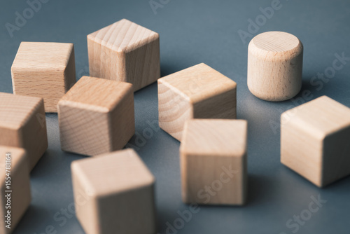 One round block among many cubes, symbolizing brand differentiation, unique value, market positioning, and business strategy