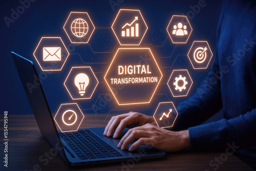Digital transformation concept with glowing icons and person using laptop technology