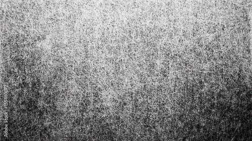 A tightly-woven, close-up shot of tangled gray fibers creating a fuzzy texture