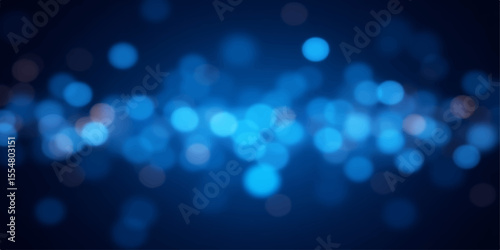 Abstract blue background with glowing defocused Christmas lights for a bright holiday celebration
